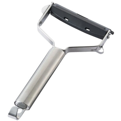 Metal peeler with a silver handle on a white background