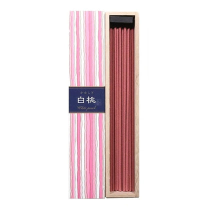 Kayuragi White Peach incense sticks displayed inside wooden box with pink striped packaging